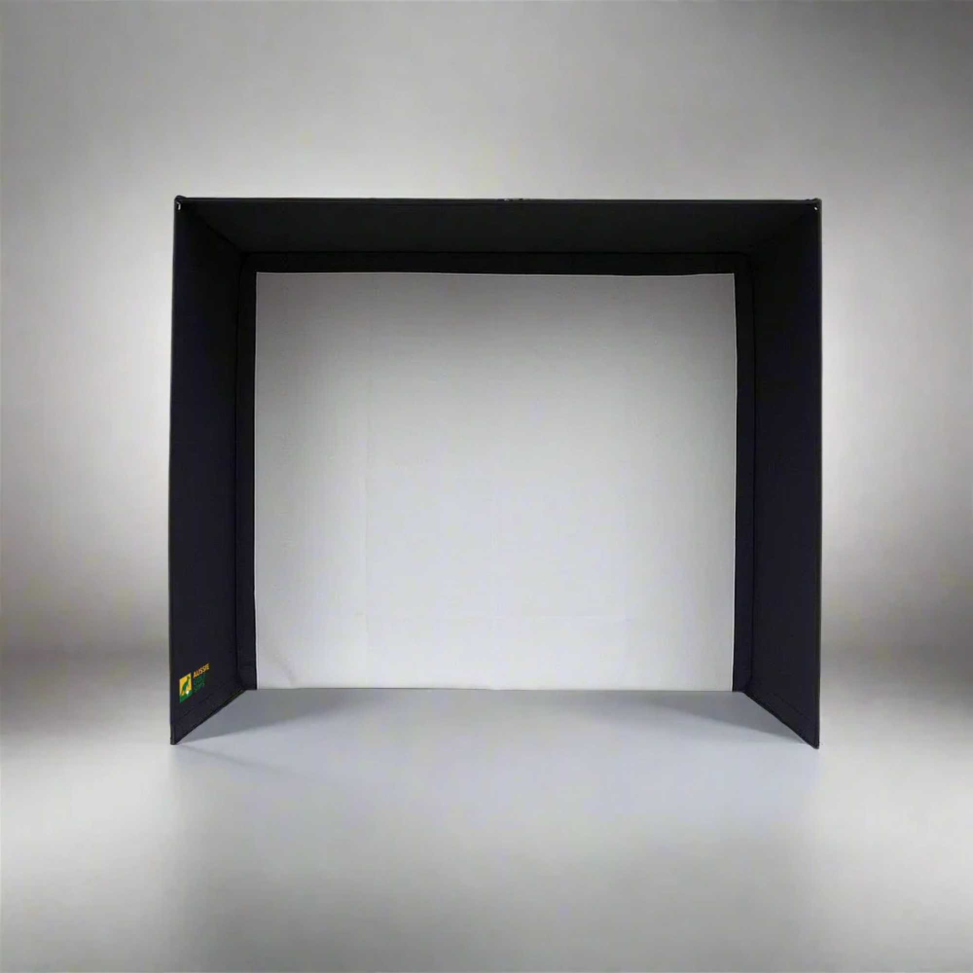 Golf Simulator Enclosure with white impact screen on a grey back drop