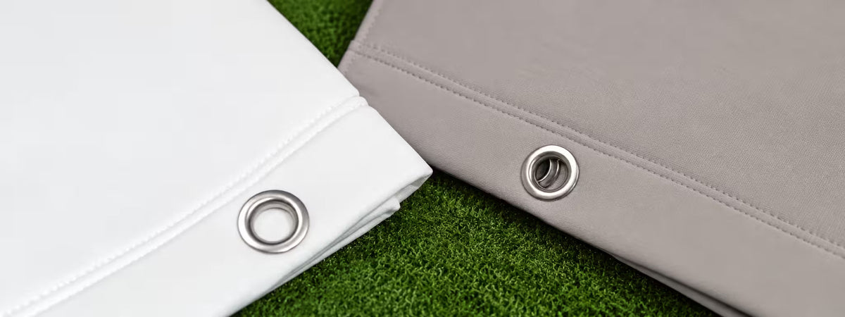 Grey and white impact screens on grass.