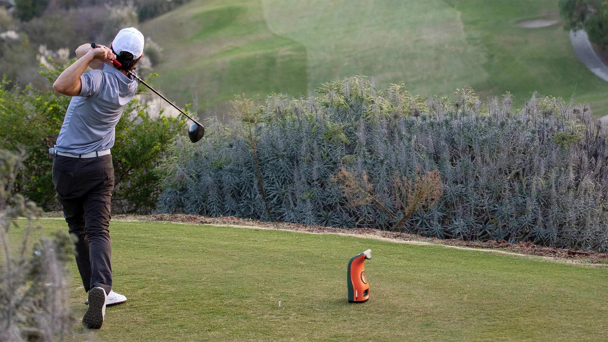 Bushnell Launch Pro with man swinging golf club