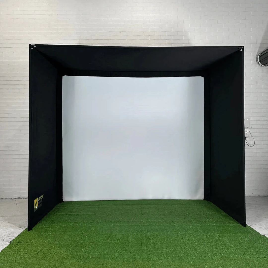 Front view of `The RooBox` golf simulator enclosure on green turf