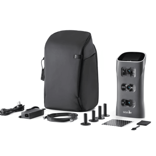 Golf Joy Spica 3 launch monitor in dark gray with black carrying case, power cord, and accessories.