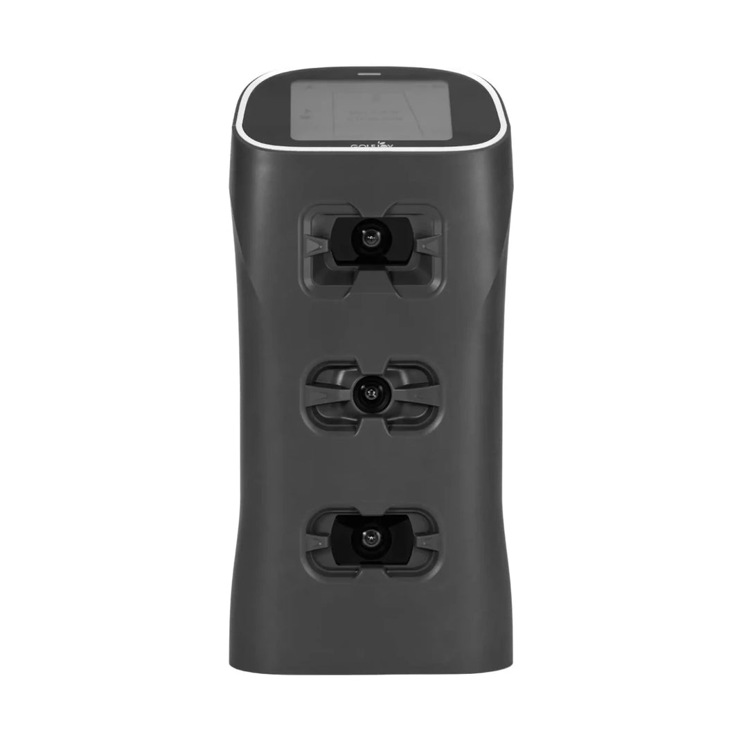 Golf Joy Spica 3 launch monitor: compact dark gray device with a white top edge, screen, and three visible cameras.