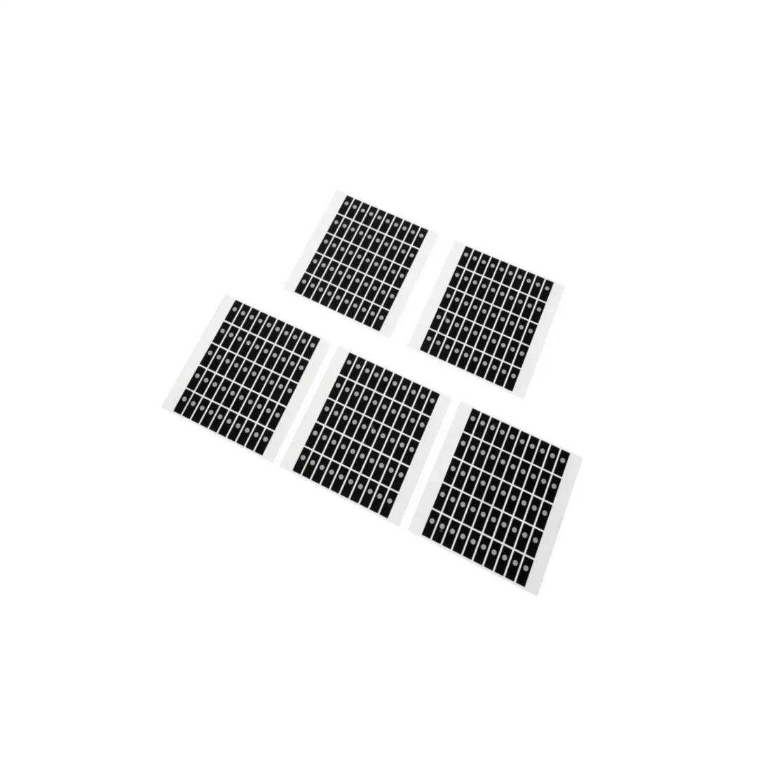 Five sheets of small, black and white reflective golf ball stickers for the Golf Joy Spica 3 Launch Monitor.