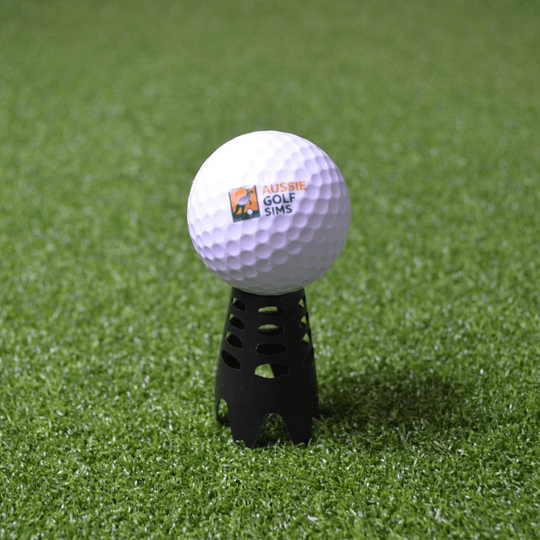 Golf Simulator tee  sitting on golf turf with an aussie golf sims ball on it