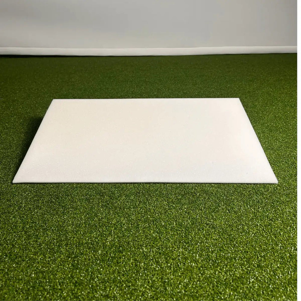 Large White Foam Wedge on Green Golf Simulator Turf