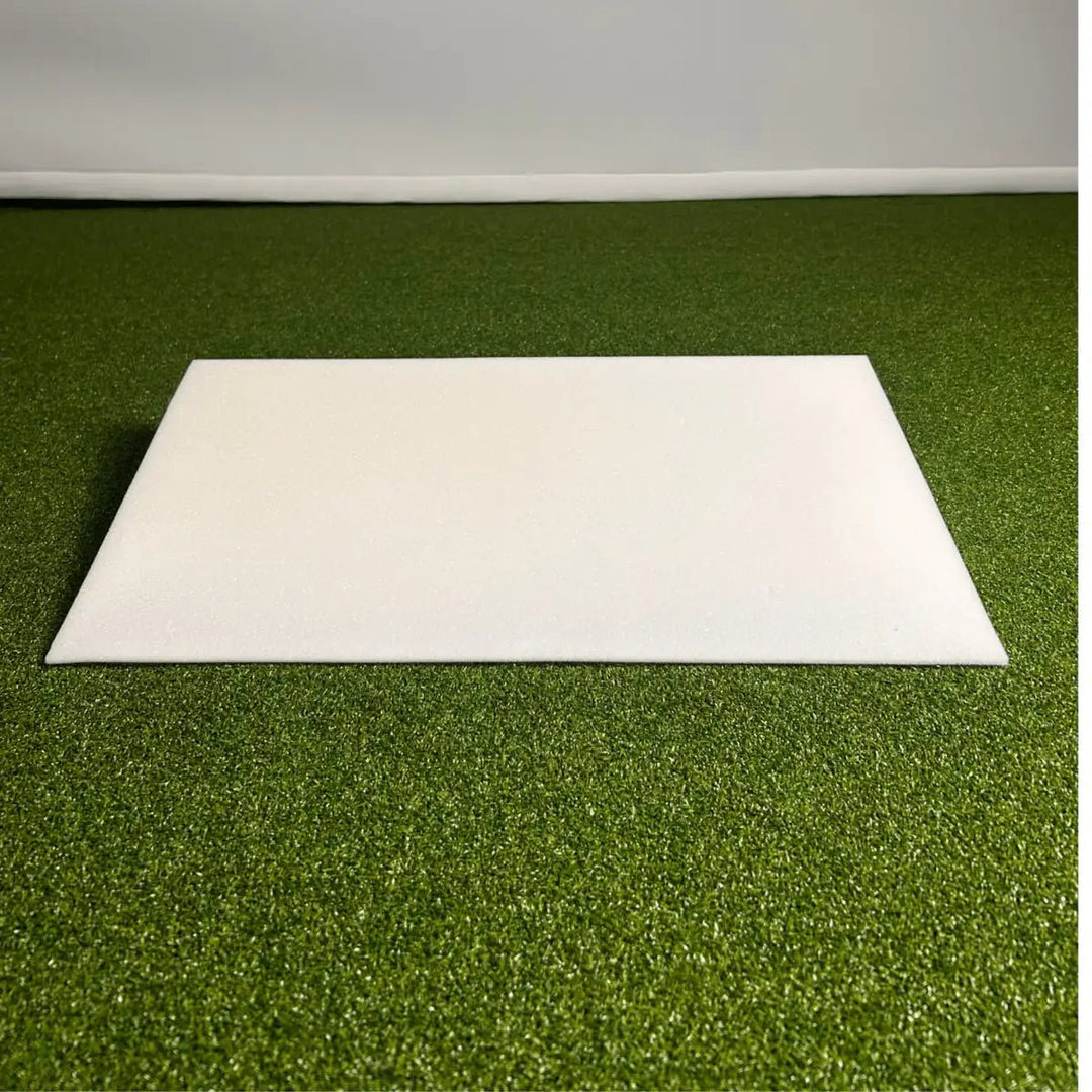 Large White Foam Wedge on Green Golf Simulator Turf