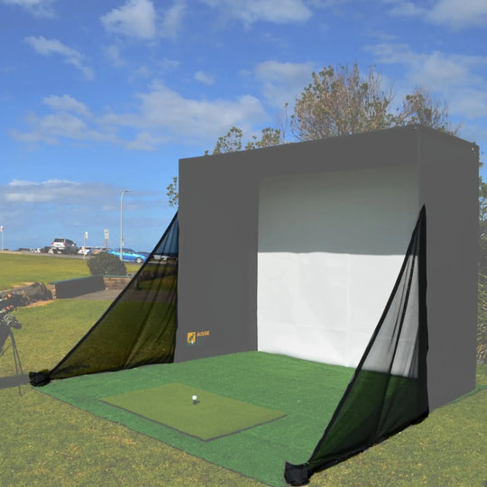 Golf simulator enclosure set up outdoors with black side netting highlighted