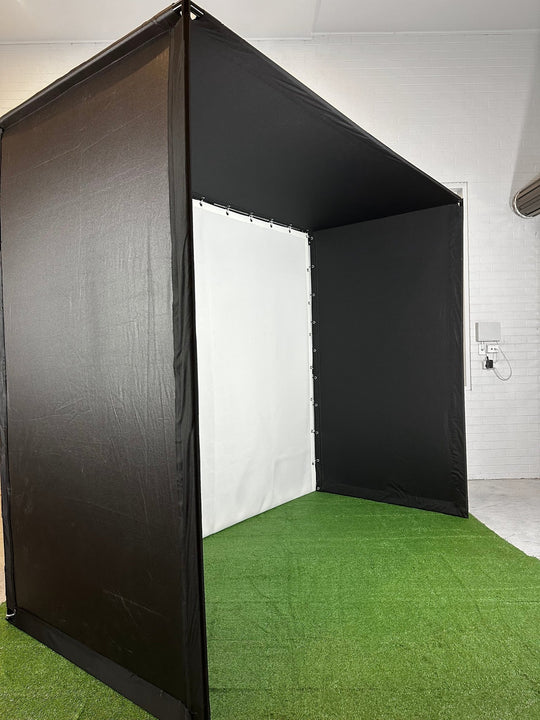 Golf Simulator Enclosure side angle in white walled room