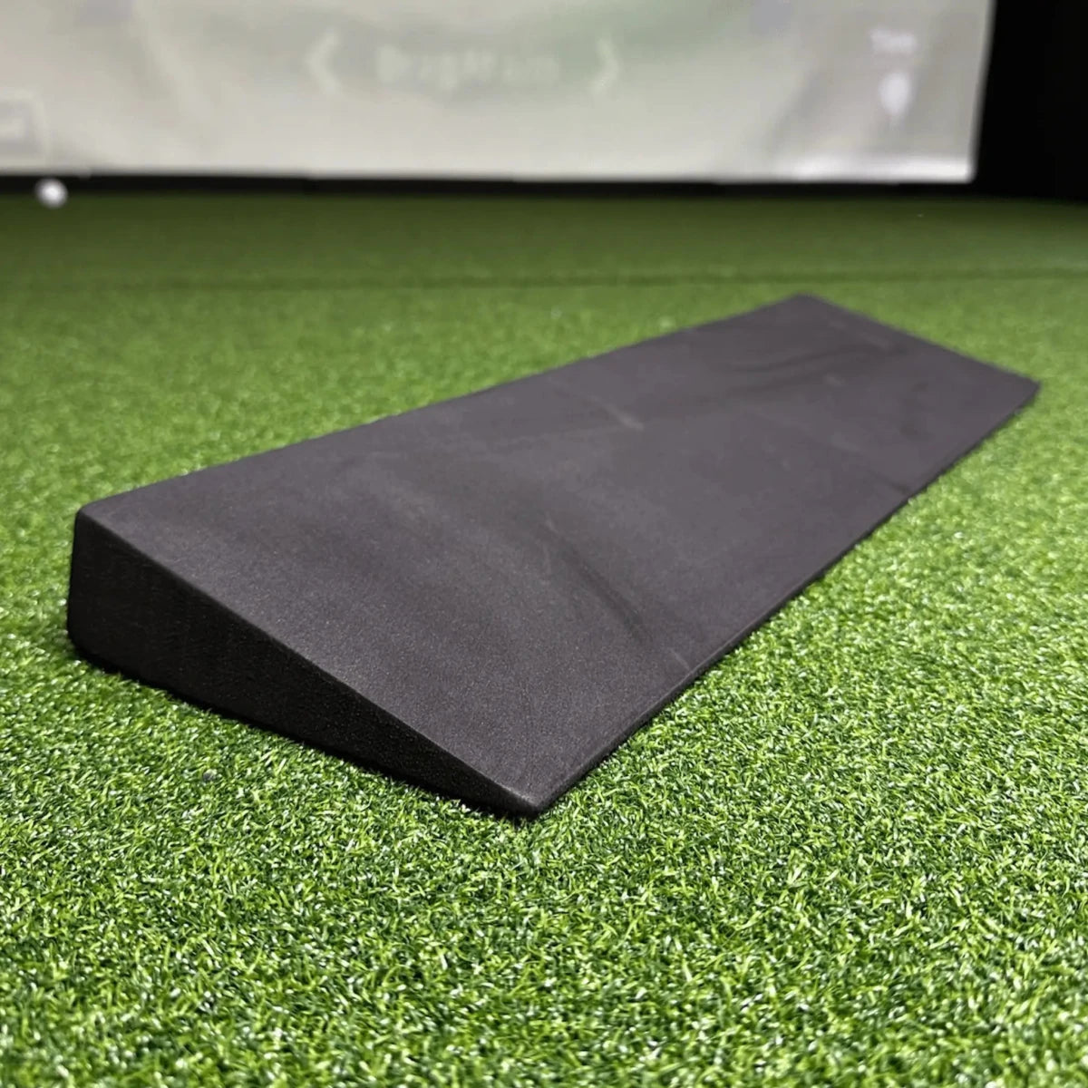 Slim Black EVA Foam Wedge on Green Golf Simulator Turf
