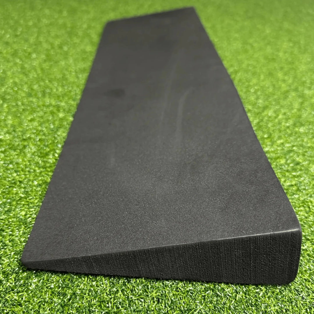 Slim Black Foam Wedge on Green Golf Simulator Turf