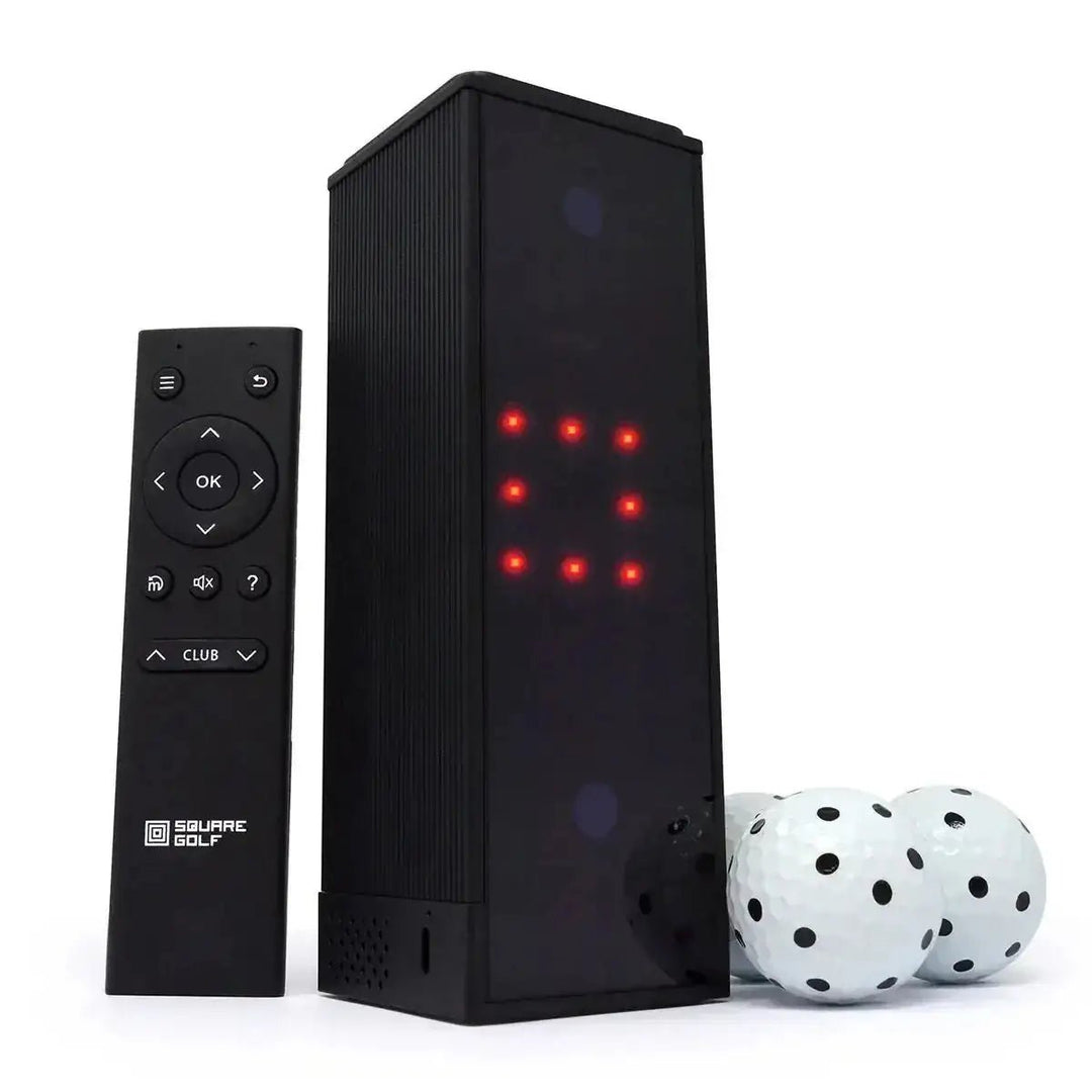 Black Square Golf home indoor launch monitor with red lights, remote, and three white golf balls.