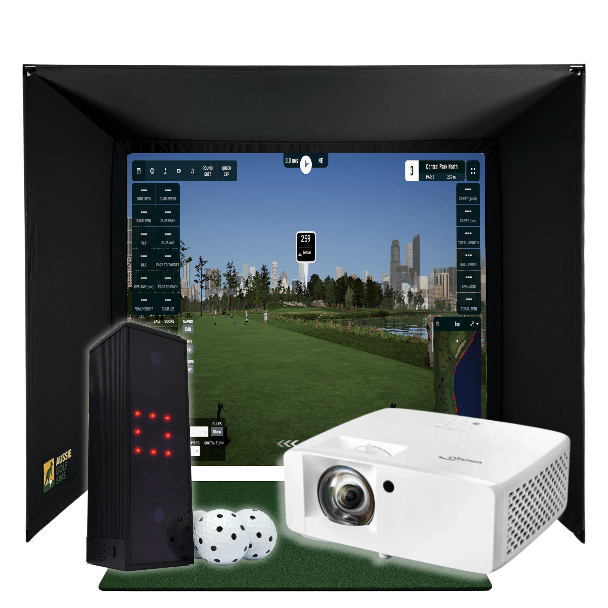 Black golf simulator enclosure with a projected course, white projector, launch monitor, and golf balls.